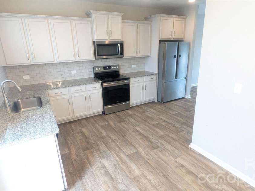 12417 Bryton Ridge Parkway, Huntersville, NC 28078.  MLS# CAR4401551, YatesRealty ID 3563. Kitchen from Back door view