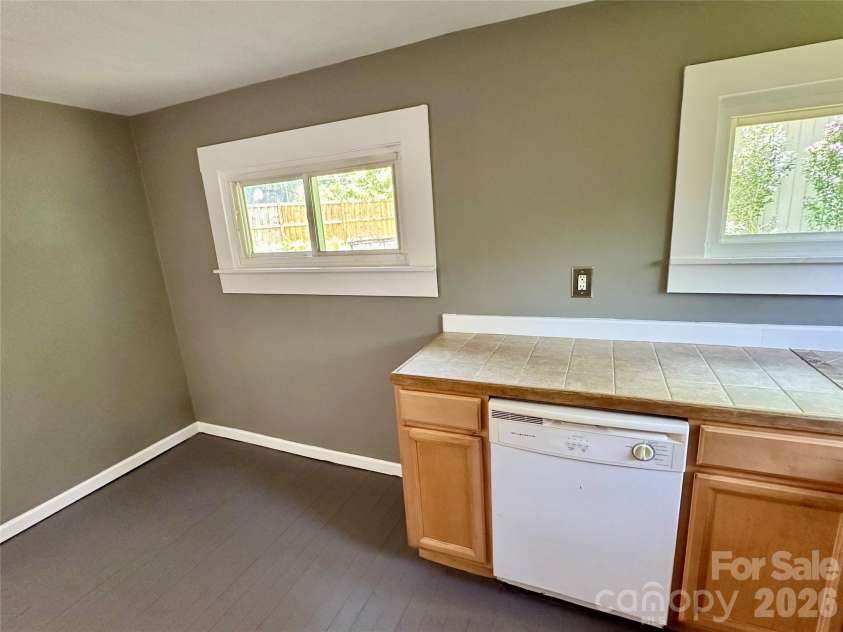 12 Penley Avenue, Asheville, NC 28804.  MLS# CAR4379338, YatesRealty ID 35634. Sunny kitchen faces back yard.