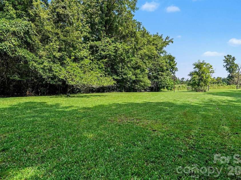 7707 Waxhaw Highway, Waxhaw, NC 28173.  MLS# CAR4401660, YatesRealty ID 35665. Huge backyard