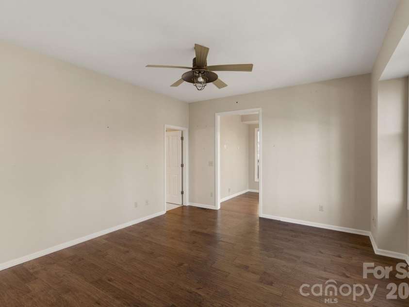 451 Crescent Trail, Highlands, NC 28741.  MLS# CAR4342214, YatesRealty ID 3567. Primary Ensuite Bedroom (doorways to ensuite bath and office/sitting room)