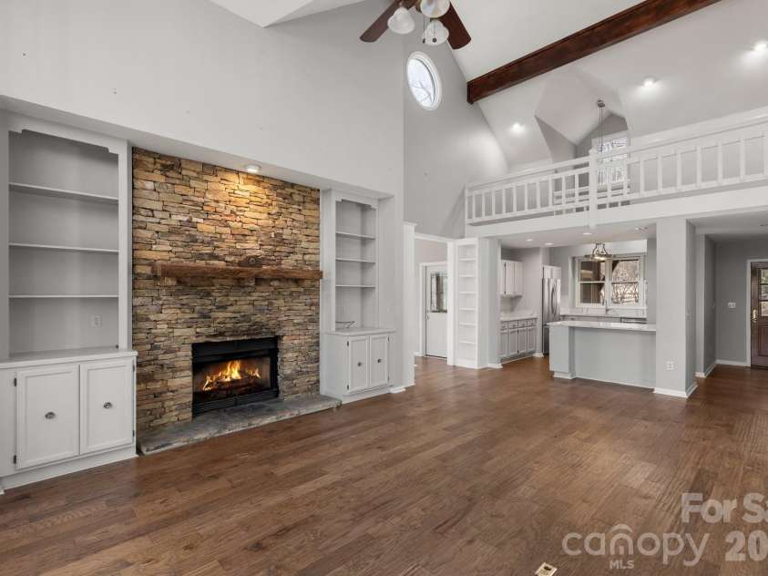 451 Crescent Trail, Highlands, NC 28741.  MLS# CAR4342214, YatesRealty ID 3567. Stone Gas Log Fireplace in Great Room
