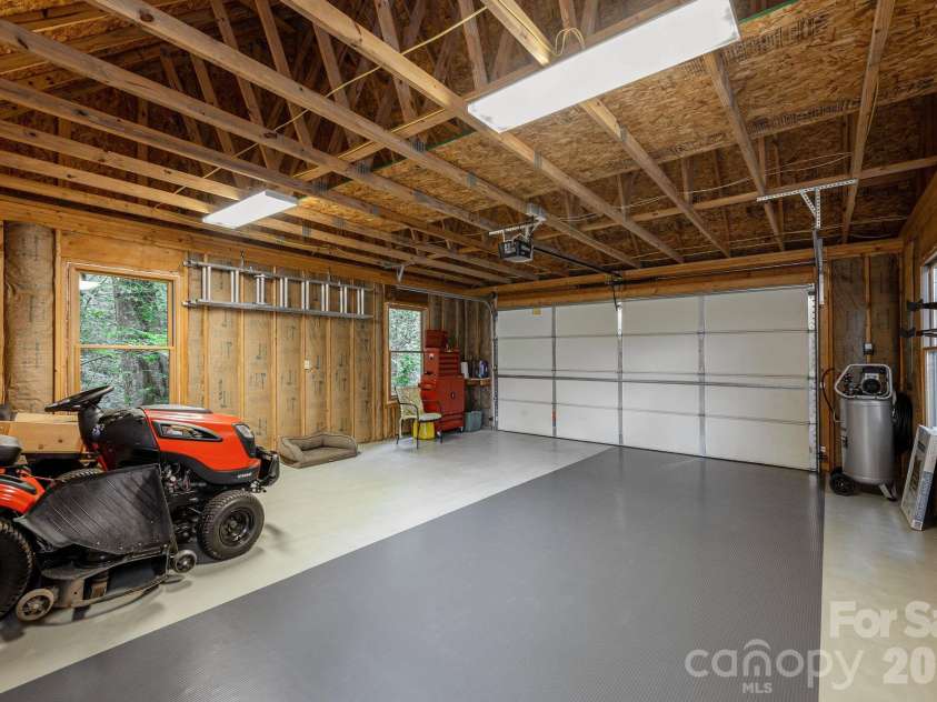 763 Deerlake Road, Brevard, NC 28712.  MLS# CAR4390981, YatesRealty ID 35678. Detached garage (sit down mower does not convey)