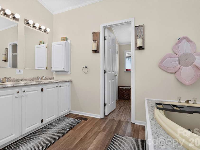 602 Timberwood Drive, Fort Mill, SC 29708.  MLS# CAR4400100, YatesRealty ID 35682. Primary bath features dual sinks and soaking tub!