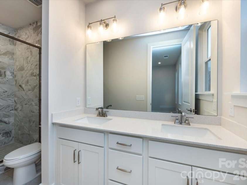 6012 Pivot Court, Charlotte, NC 28205.  MLS# CAR4357047, YatesRealty ID 35686. Dual vanity primary bathroom