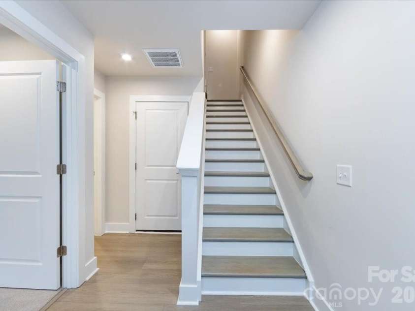 6012 Pivot Court, Charlotte, NC 28205.  MLS# CAR4357047, YatesRealty ID 35686. Oak box stairs