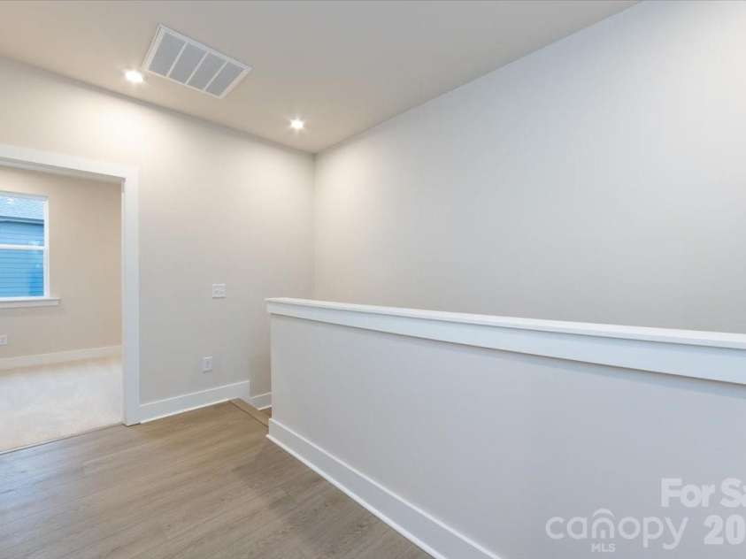 6012 Pivot Court, Charlotte, NC 28205.  MLS# CAR4357047, YatesRealty ID 35686. Third floor landing