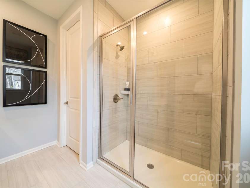 6041 Longar Lane, Charlotte, NC 28269.  MLS# CAR4400027, YatesRealty ID 35687. Primary bathroom walk-in shower