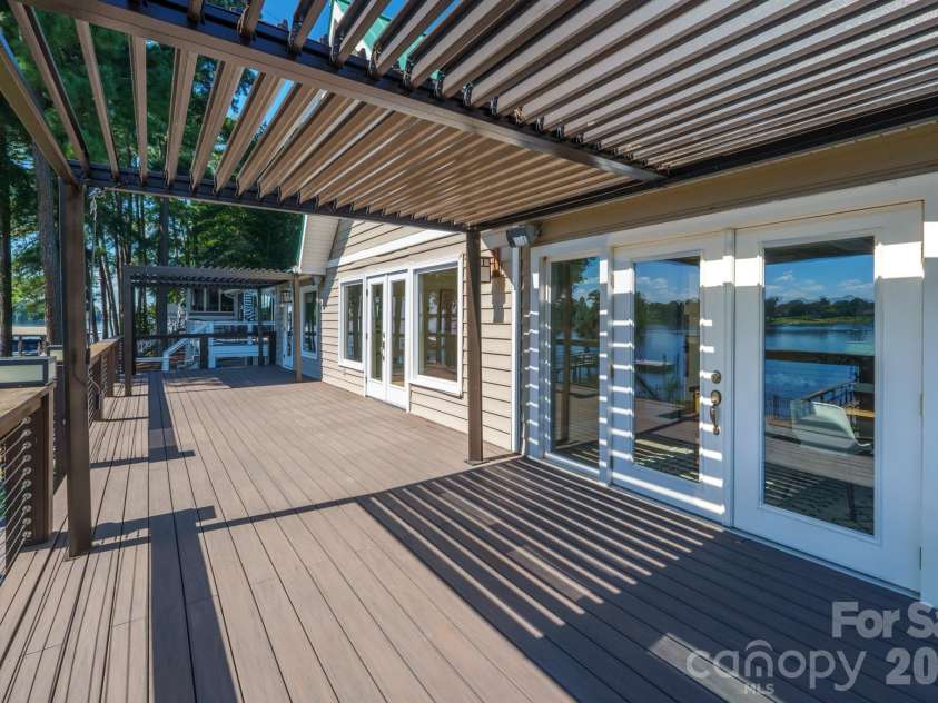 20919 Island Forest Drive, Cornelius, NC 28031.  MLS# CAR4428890, YatesRealty ID 3569. Full deck with 2 pergolas at either end that can be open or closed for roof