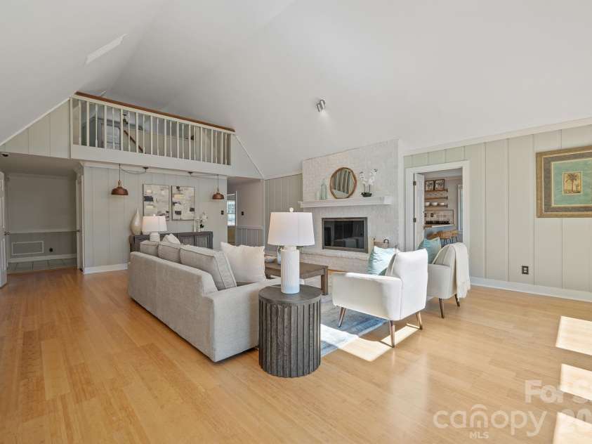 20919 Island Forest Drive, Cornelius, NC 28031.  MLS# CAR4428890, YatesRealty ID 3569. Great room showing the loft area above