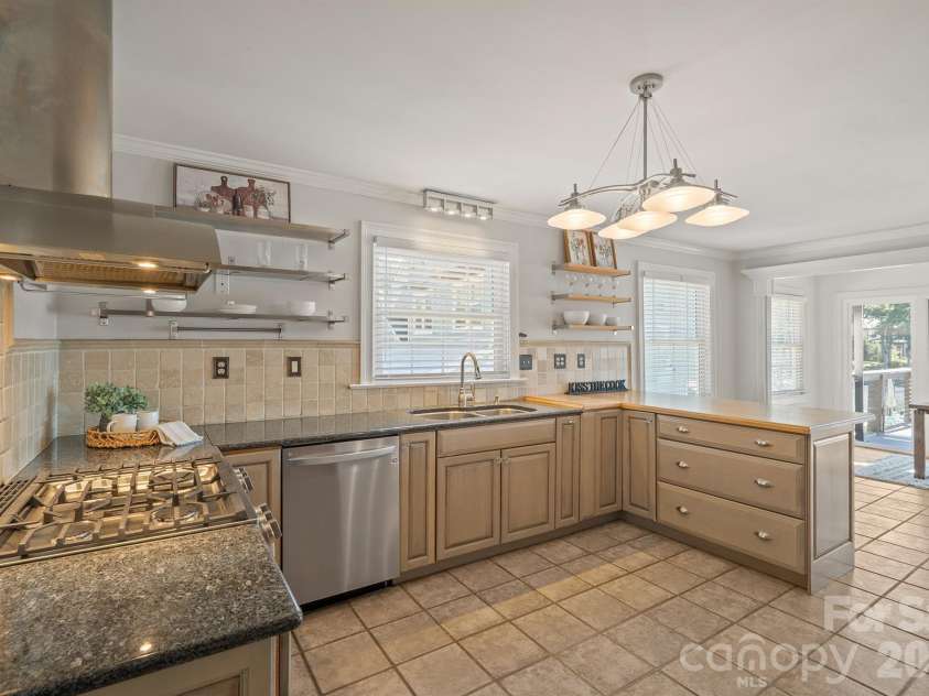 20919 Island Forest Drive, Cornelius, NC 28031.  MLS# CAR4428890, YatesRealty ID 3569. Kitchen has stainless appliances and greywashed cabinetry