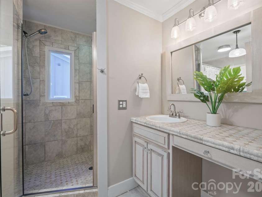 20919 Island Forest Drive, Cornelius, NC 28031.  MLS# CAR4428890, YatesRealty ID 3569. Walk in shower with dual heads