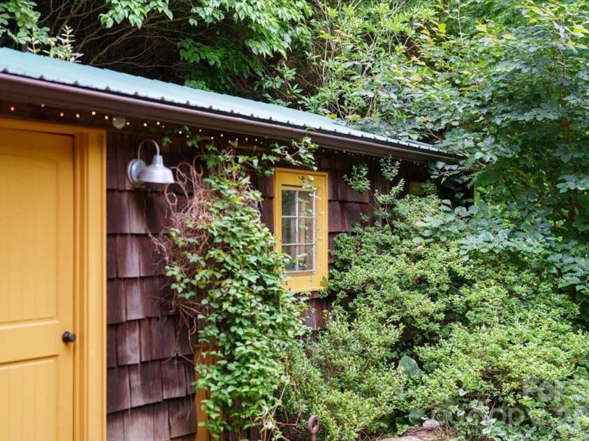 128 Barnet Mountain Drive, Marshall, NC 28753.  MLS# CAR4390222, YatesRealty ID 35721. Spacious shed for tools and garden supplies.