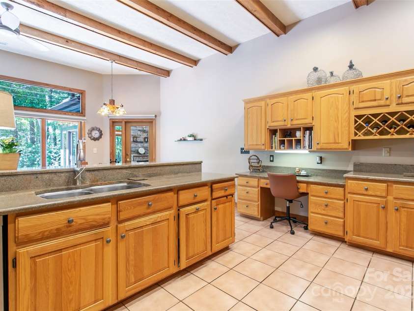 200 Maple Hill Drive, Flat Rock, NC 28731.  MLS# CAR4258451, YatesRealty ID 35728. Cooking will be a dream in this large kitchen