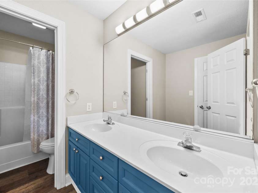 112 Fransher Lane, Mooresville, NC 28117.  MLS# CAR4331248, YatesRealty ID 3573. Guest Bathroom with double sink vanity and shower/tub combo