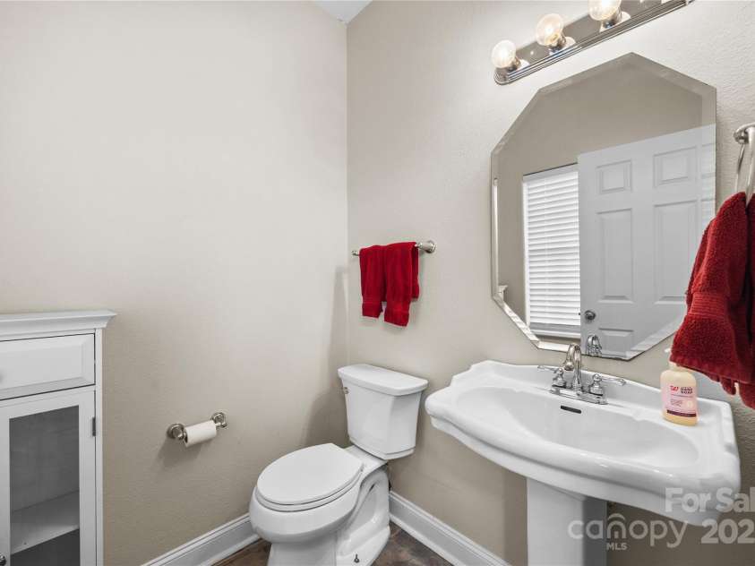 112 Fransher Lane, Mooresville, NC 28117.  MLS# CAR4331248, YatesRealty ID 3573. Guest half bath on the main