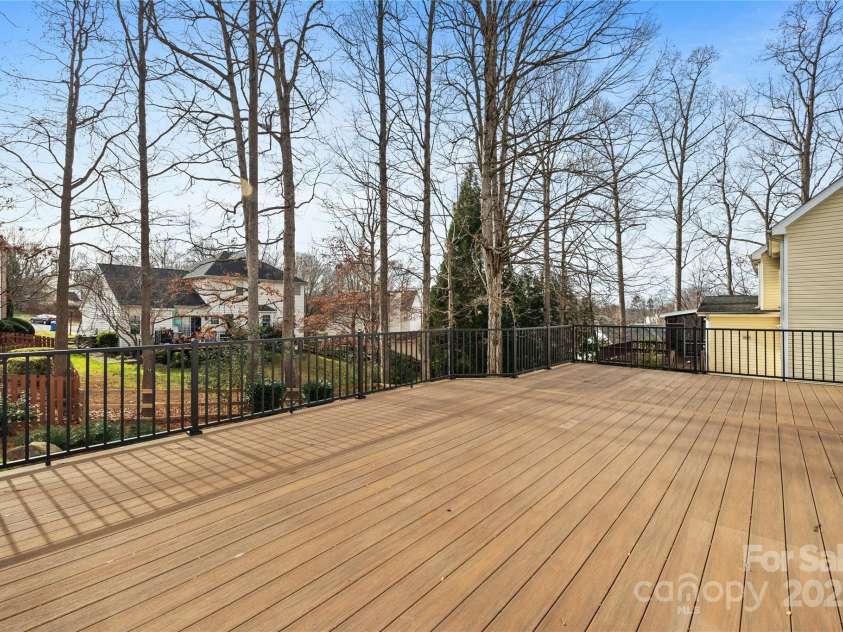 112 Fransher Lane, Mooresville, NC 28117.  MLS# CAR4331248, YatesRealty ID 3573. Huge backyard deck overlooks the beautiful backyard!