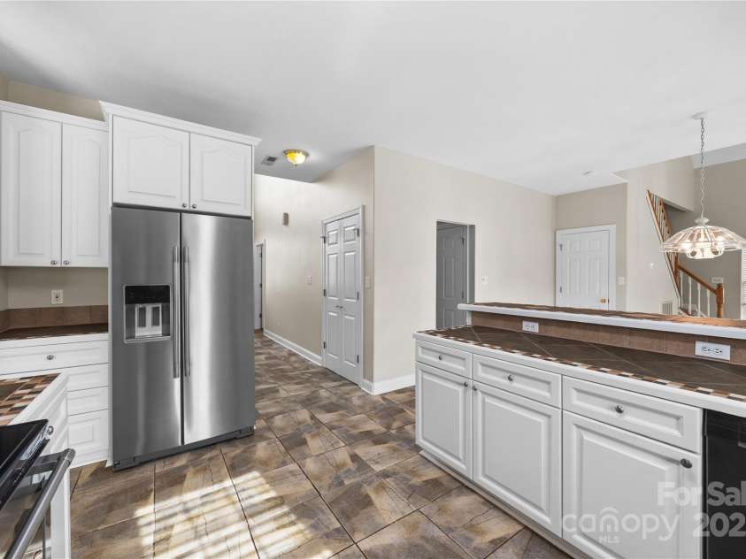 112 Fransher Lane, Mooresville, NC 28117.  MLS# CAR4331248, YatesRealty ID 3573. Newly painted kitchen cabinets offer tons of storage in this spacious kitchen.