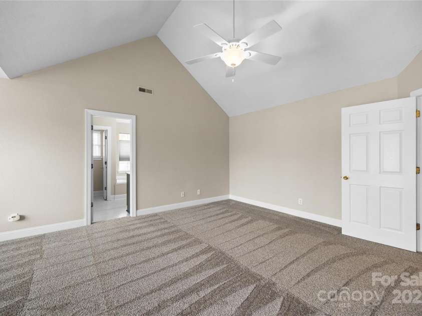 112 Fransher Lane, Mooresville, NC 28117.  MLS# CAR4331248, YatesRealty ID 3573. Primary bedroom with vaulted ceilings