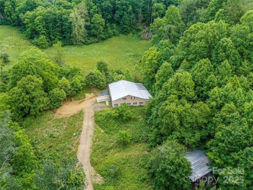 263 Wolf Mountain Road, Green Mountain, NC 28740.  MLS# CAR4148202, YatesRealty ID 3574. 60x80 metal building/workshop located on lower portion of property