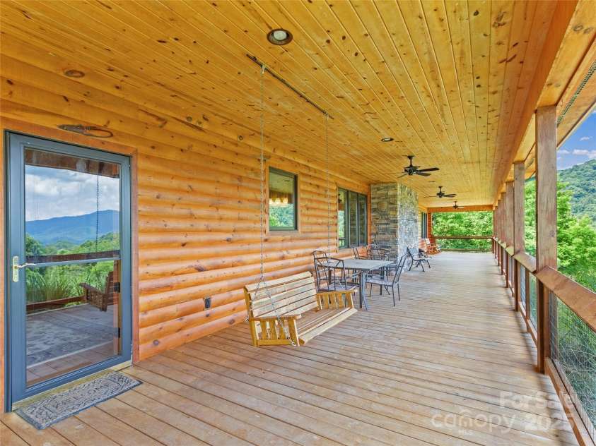263 Wolf Mountain Road, Green Mountain, NC 28740.  MLS# CAR4148202, YatesRealty ID 3574. Covered front porch
