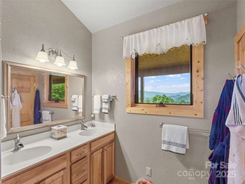 263 Wolf Mountain Road, Green Mountain, NC 28740.  MLS# CAR4148202, YatesRealty ID 3574. Primary bathroom