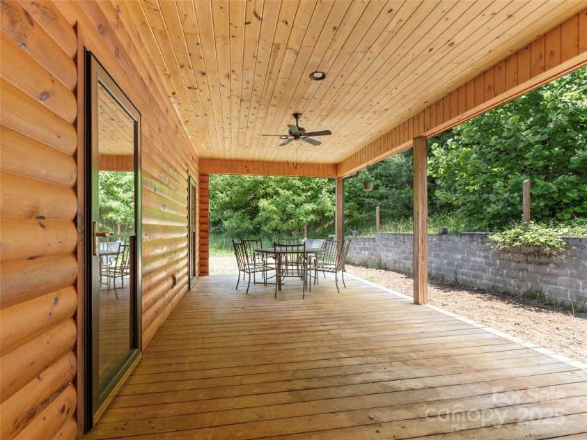 263 Wolf Mountain Road, Green Mountain, NC 28740.  MLS# CAR4148202, YatesRealty ID 3574. Rear covered porch