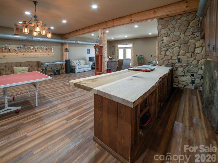 4885 Grandin Road, Lenoir, NC 28645.  MLS# CAR4346888, YatesRealty ID 35749. Lower level, live edge bar