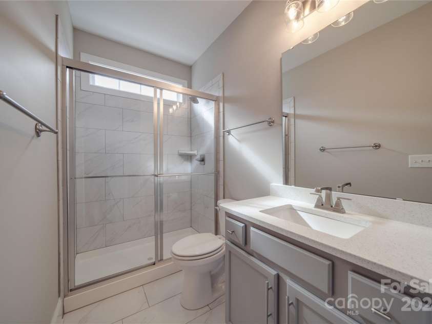 10881 Greenvale Drive, Harrisburg, NC 28075.  MLS# CAR4196765, YatesRealty ID 3575. Downstairs Full Bathroom