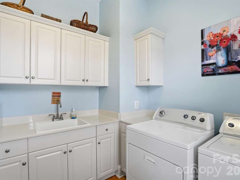 110 Yale Loop, Mooresville, NC 28117.  MLS# CAR4353992, YatesRealty ID 3578. Laundry on main level w/sink and cabinets