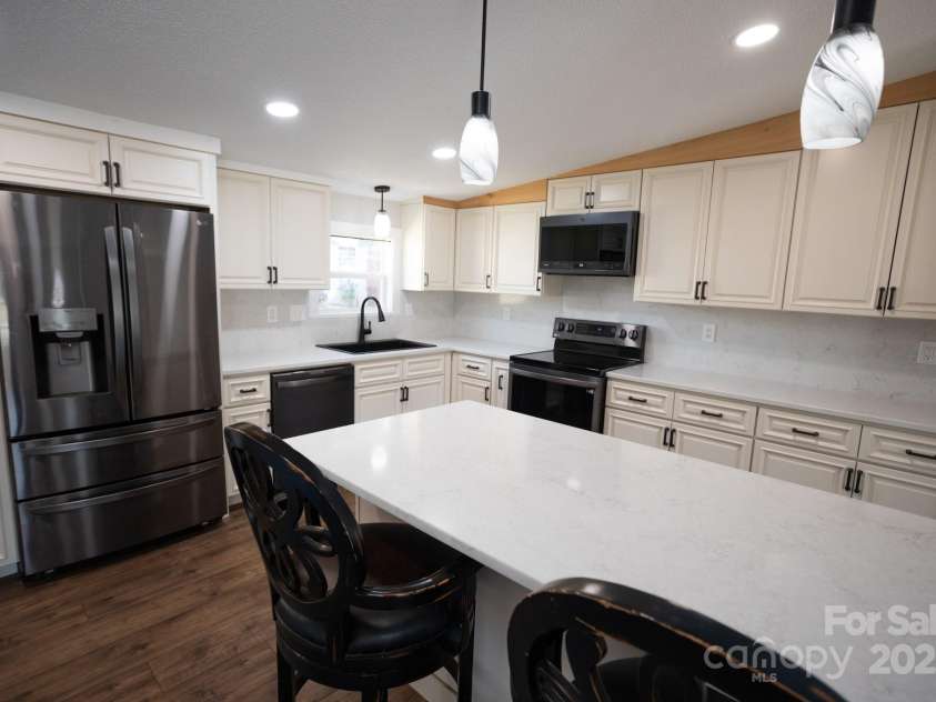 111 Hollar Street, Morganton, NC 28655.  MLS# CAR4232117, YatesRealty ID 3579. Renovated Kitchen with Peninsula Countertop