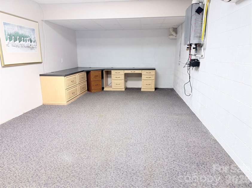 7605 Keating Drive, Oak Ridge, NC 27310.  MLS# CAR4402309, YatesRealty ID 35792. Basement Office