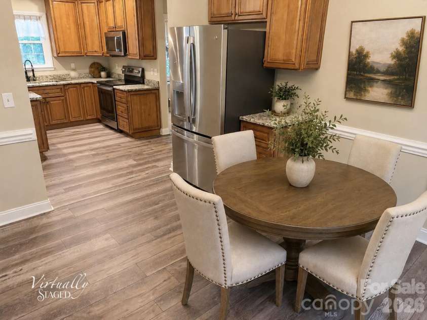 7605 Keating Drive, Oak Ridge, NC 27310.  MLS# CAR4402309, YatesRealty ID 35792. Dining Room Virtually Staged