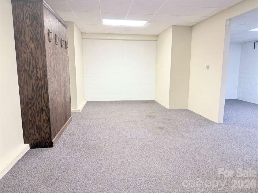 7605 Keating Drive, Oak Ridge, NC 27310.  MLS# CAR4402309, YatesRealty ID 35792. Recreation Room with Murphy Bed