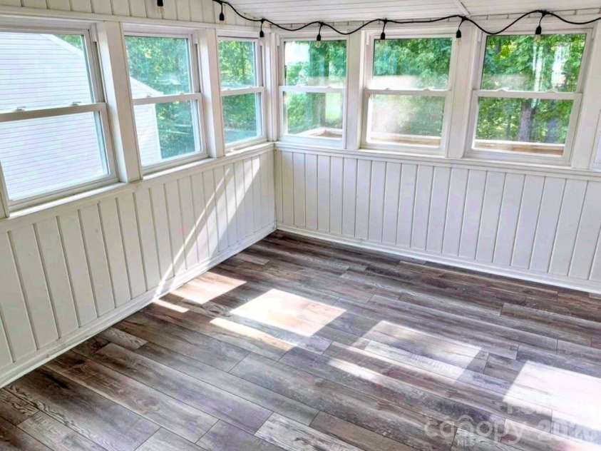 7605 Keating Drive, Oak Ridge, NC 27310.  MLS# CAR4402309, YatesRealty ID 35792. Sunroom off the Den