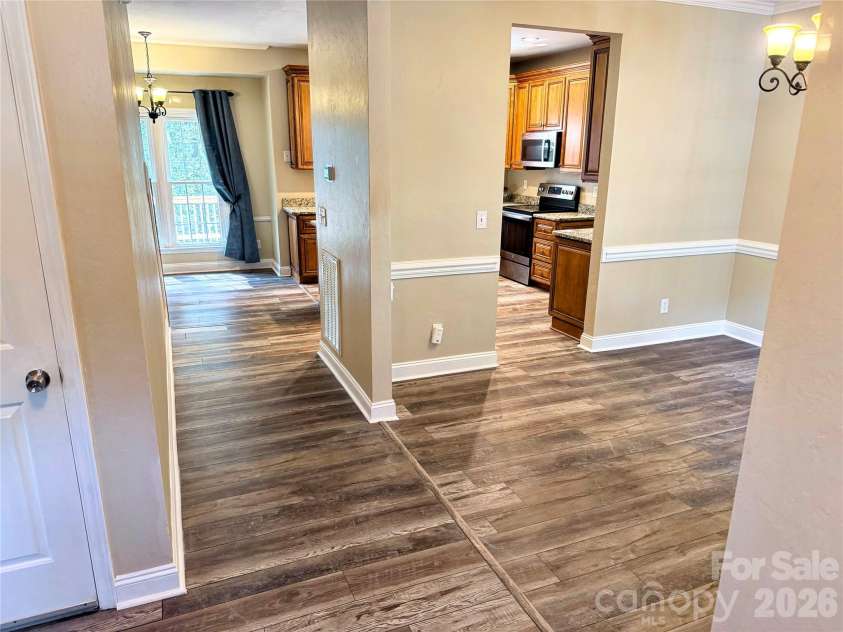 7605 Keating Drive, Oak Ridge, NC 27310.  MLS# CAR4418989, YatesRealty ID 35792. Entryway and Dining Room