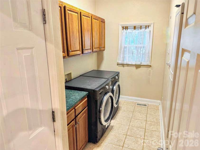 7605 Keating Drive, Oak Ridge, NC 27310.  MLS# CAR4418989, YatesRealty ID 35792. Laundry Room