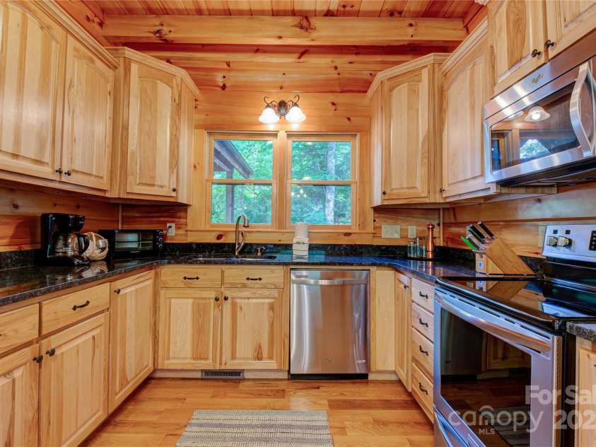 200 Blue Gill Drive, Lake Lure, NC 28746.  MLS# CAR4231611, YatesRealty ID 3580. Kitchen with granite counters and nice appliances