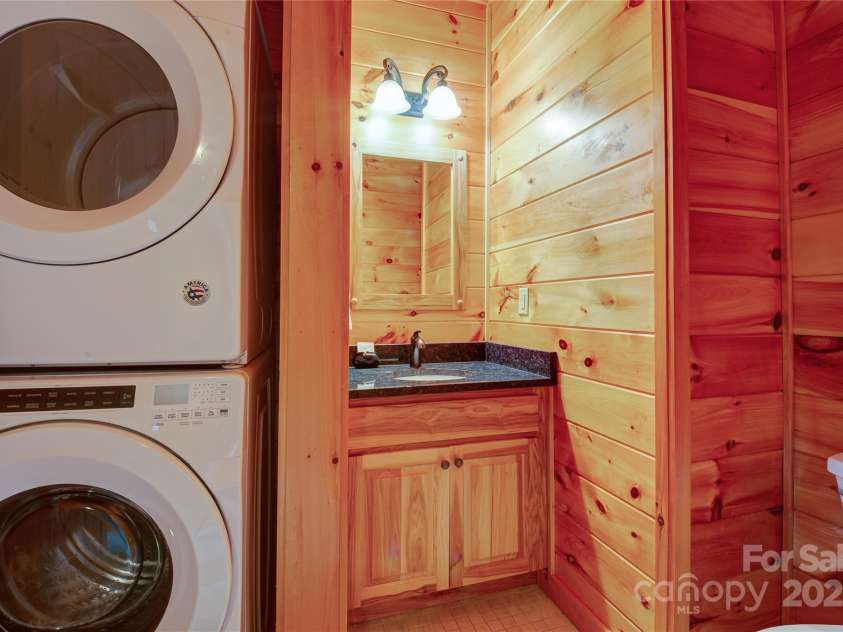 200 Blue Gill Drive, Lake Lure, NC 28746.  MLS# CAR4231611, YatesRealty ID 3580. Laundry zone located on main level with half bath