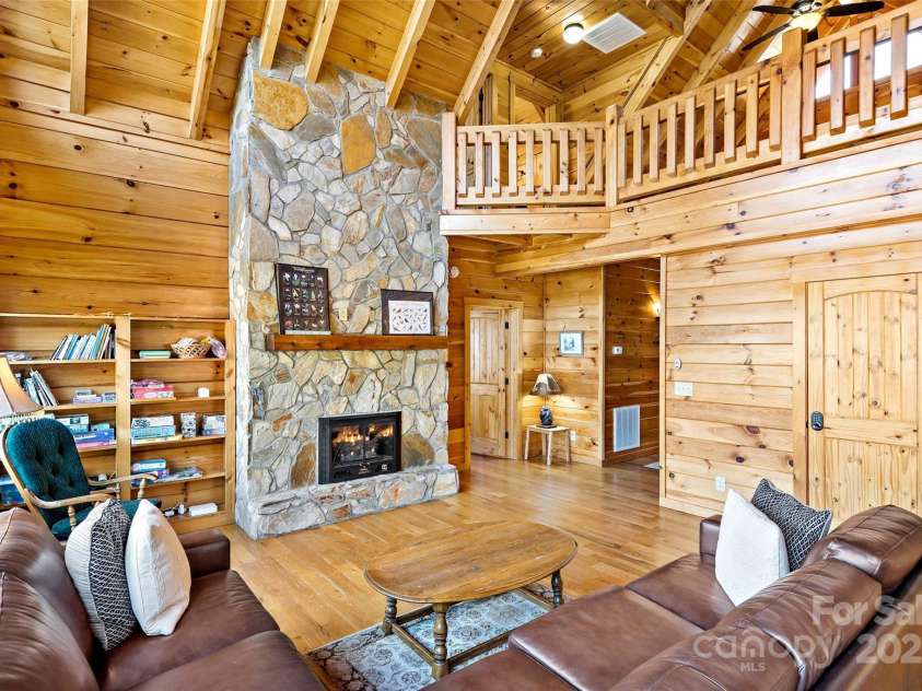 200 Blue Gill Drive, Lake Lure, NC 28746.  MLS# CAR4231611, YatesRealty ID 3580. Light and Bright, spacious Livingroom with stone fireplace
