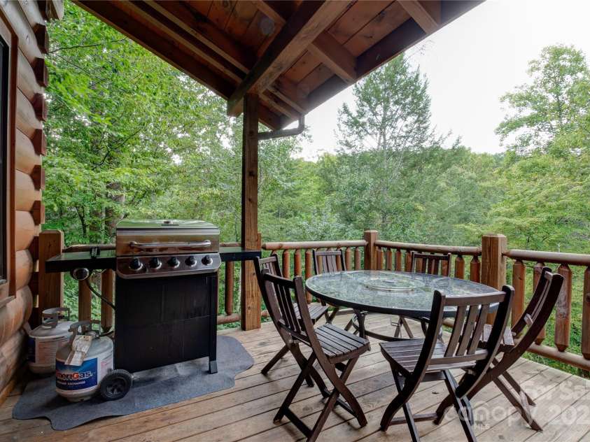 200 Blue Gill Drive, Lake Lure, NC 28746.  MLS# CAR4231611, YatesRealty ID 3580. Main level deck breakfast area