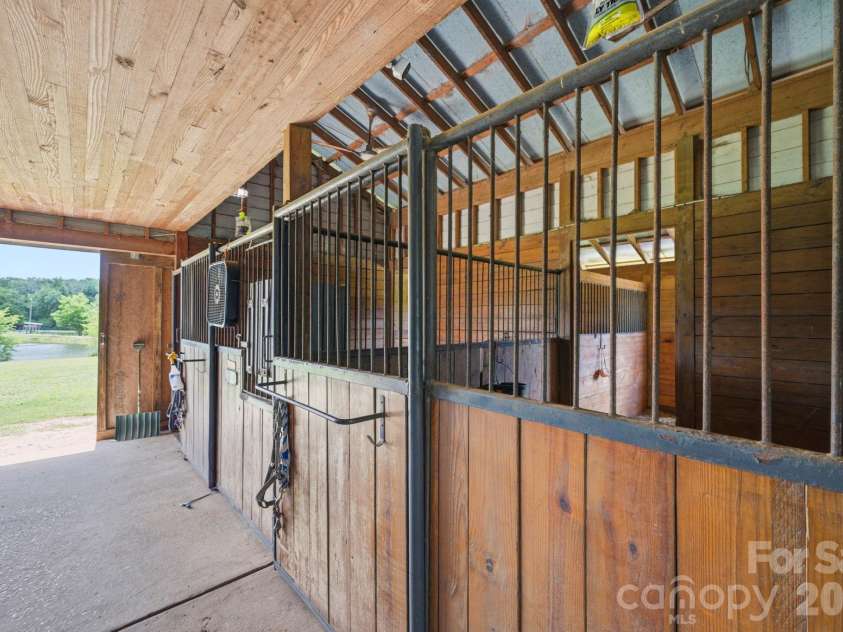 2545 Rocky River Road, Lancaster, SC 29720.  MLS# CAR4394722, YatesRealty ID 35819. 12' x 12' Stalls have mats & automatic waterers