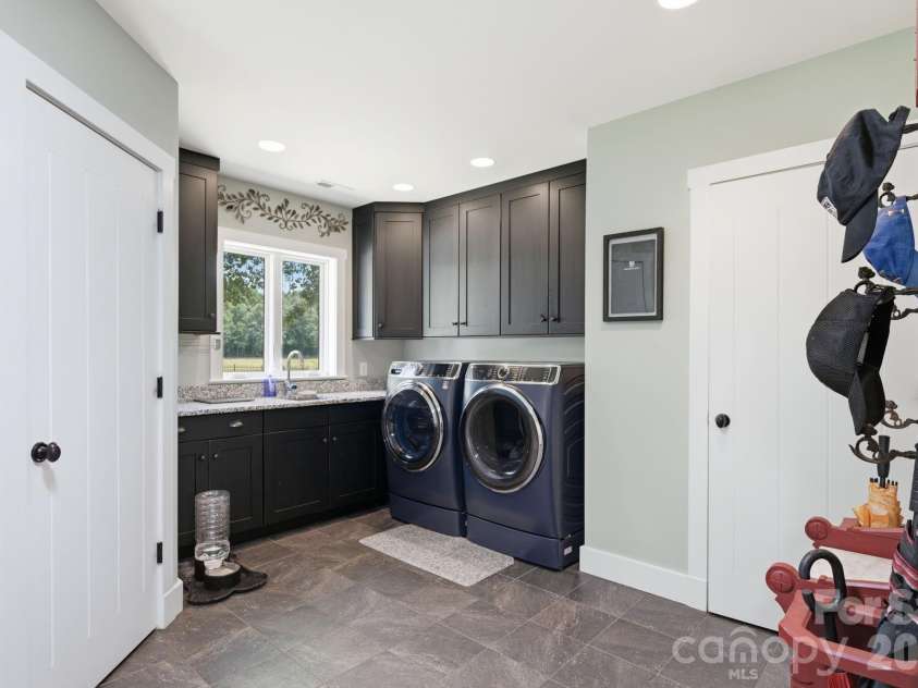 2545 Rocky River Road, Lancaster, SC 29720.  MLS# CAR4394722, YatesRealty ID 35819. Large laundry/mud room with powder bath and large storage closet