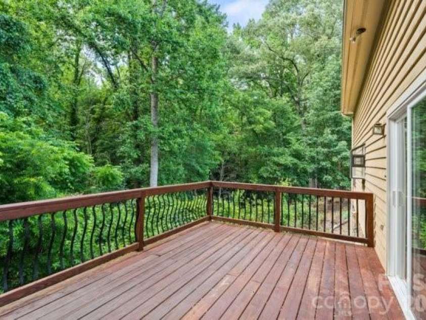 4013 Carlton Drive, Claremont, NC 28610.  MLS# CAR4381892, YatesRealty ID 35823. Walkout deck from dining area
