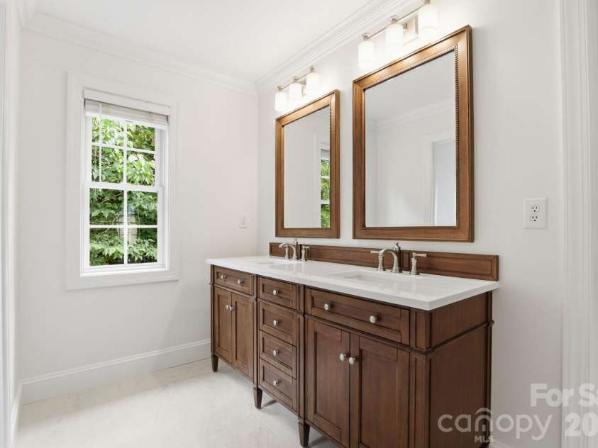 7011 Edenderry Drive, Charlotte, NC 28270.  MLS# CAR4397470, YatesRealty ID 35827. Custom dual vanity with matching mirrors