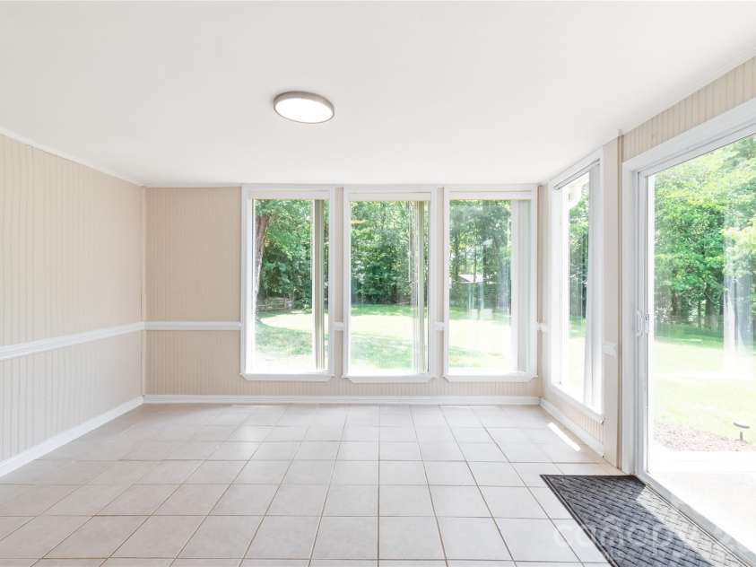 8410 Cricket Lake Drive, Charlotte, NC 28277.  MLS# CAR4399995, YatesRealty ID 35831. Sunroom w/ access to back deck