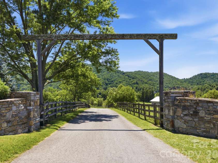 114 Cane Creek Ranch Drive, Fletcher, NC 28732.  MLS# CAR4395203, YatesRealty ID 35841. Timber-framed entrance to Cane Creek Ranch