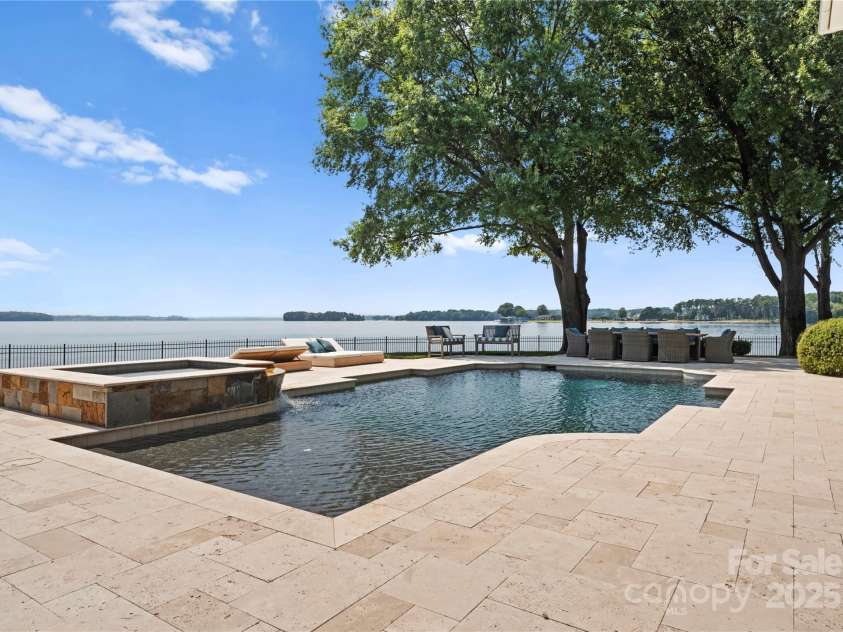 124 Wellcraft Court, Mooresville, NC 28117.  MLS# CAR4227104, YatesRealty ID 3586. Expansive water views stretchout beyond the pool and spa.