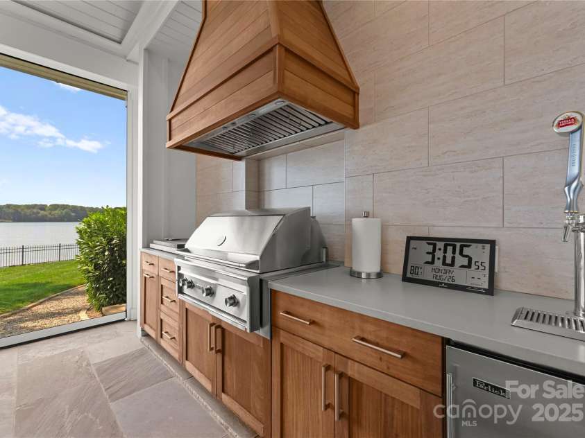 124 Wellcraft Court, Mooresville, NC 28117.  MLS# CAR4227104, YatesRealty ID 3586. Outdoor grilling area & double torpedo Kegerator within the screened patio.