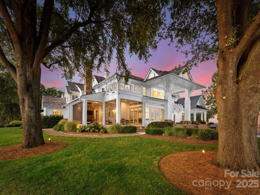 124 Wellcraft Court, Mooresville, NC 28117.  MLS# CAR4227104, YatesRealty ID 3586. The golden hour casts a radiant glow, capturing the home in all its stunning brilliance.