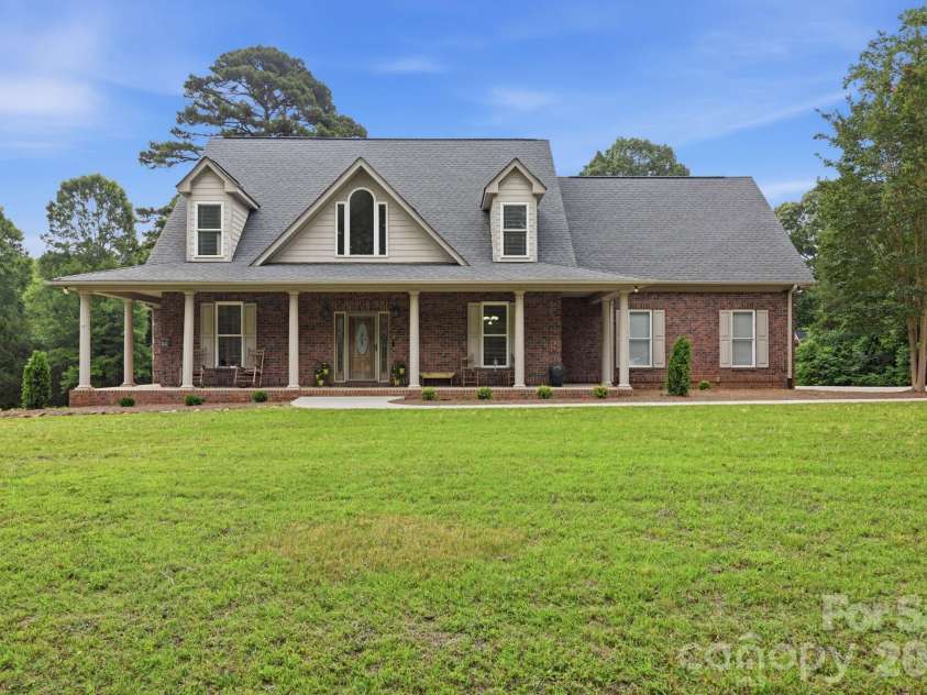 132 Monarch Lane, Mooresville, NC 28115.  MLS# CAR4391250, YatesRealty ID 35878. Beautiful Full-Brick Cape Cod Style Home